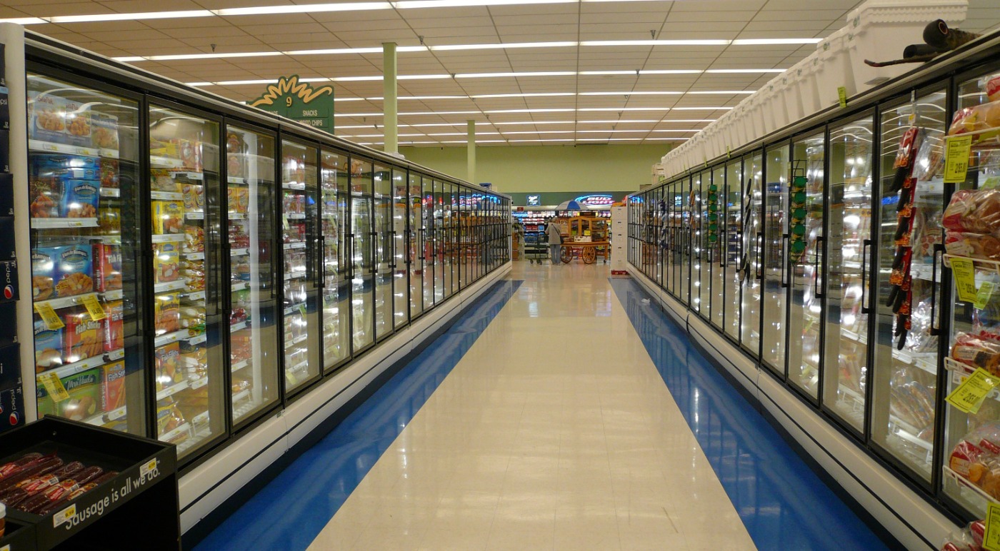 Supermarket frozen food cases in aisles
